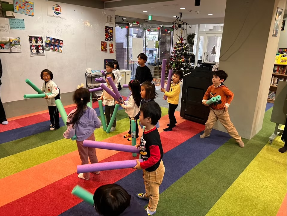 Children playing outdoors together during an active-play session at kindergarten.